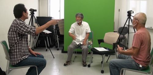 Scene of three people conversing in the Hirosaki variant of Japanese Sign Language